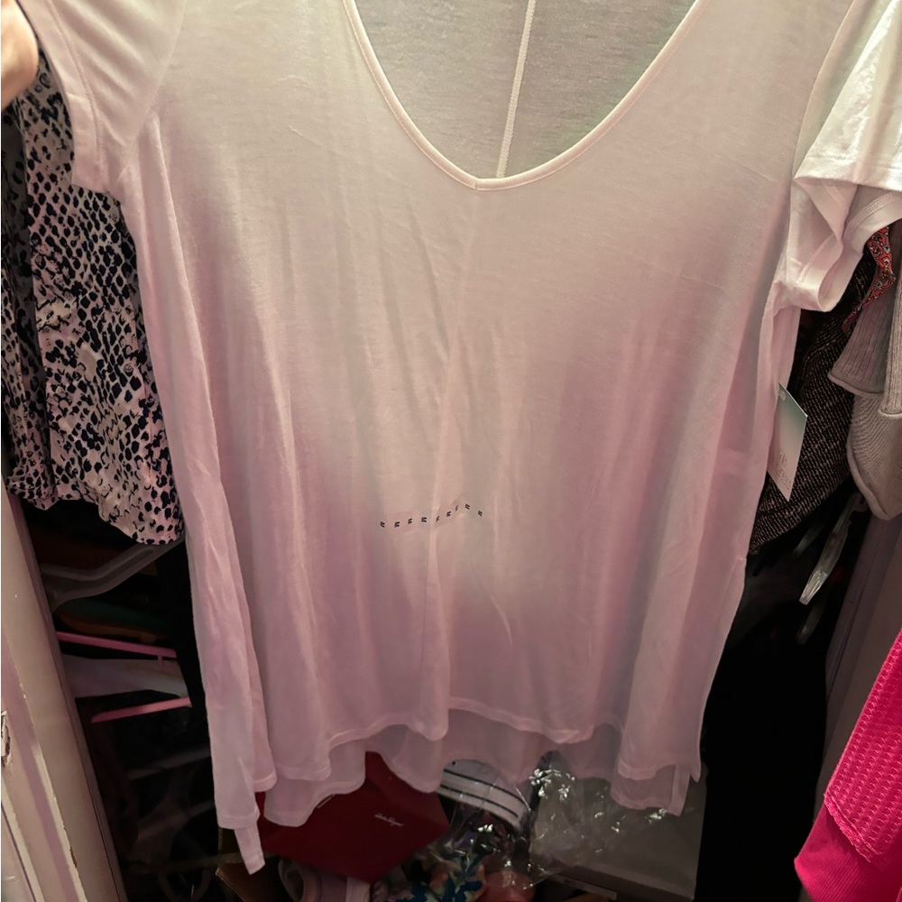 Decree white handkerchief hem top.